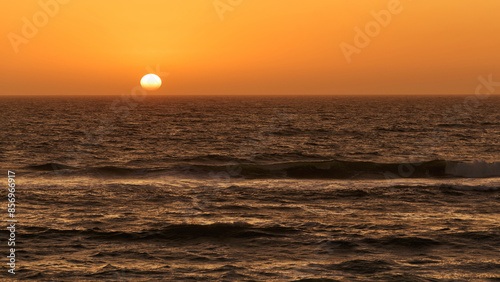 Sunset in the ocean in Walvis Bay, Namibia