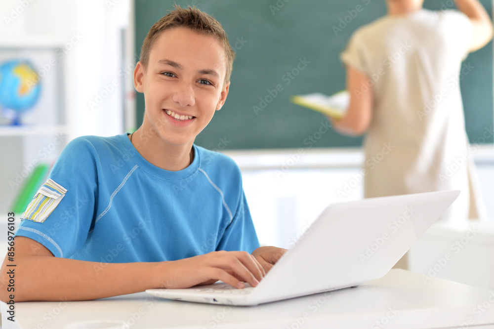 Portrait of boy studing with laptop at classroom Portrait of boy studing with laptop at classroom