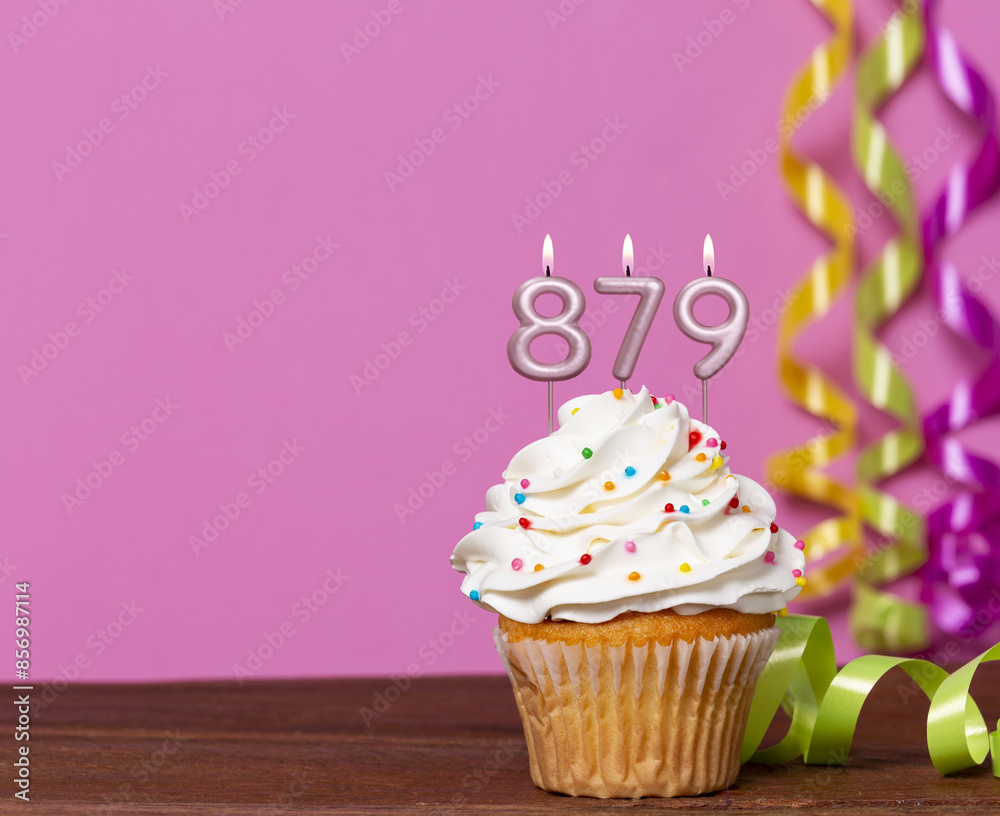 Birthday Cupcake With Candles Lit Forming The Number 879 Birthday Cupcake With Candles Lit Forming The Number 879