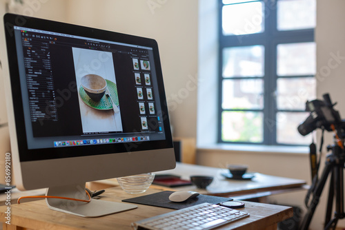 Food photography production set showing computer, keyboard, camera and tripod