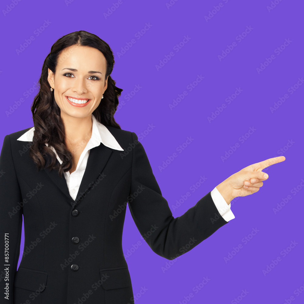 Happy smiling woman wear confident suit, showing at mock up slogan text empty blank place. Business ad concept. Isolated against violet purple wall background. Square composition image Happy smiling woman wear confident suit, showing at mock up slogan text empty blank place. Business ad concept. Isolated against violet purple wall background. Square composition image
