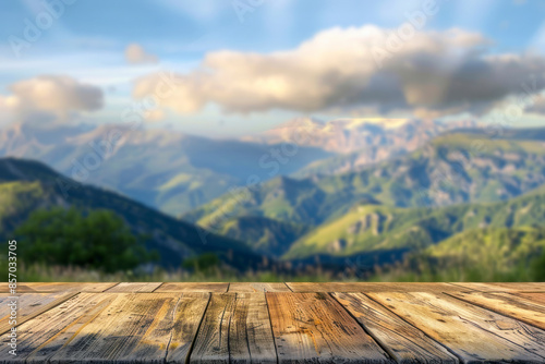 Table background of free space for your decoration and blurred landscape of mountains.