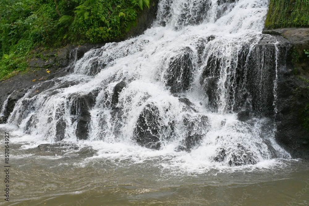 Uma Anyar Waterfall, at Kemenuh village, Gianyar Regency of Bali Indonesia, with beautiful nature landscape Uma Anyar Waterfall, at Kemenuh village, Gianyar Regency of Bali Indonesia, with beautiful nature landscape