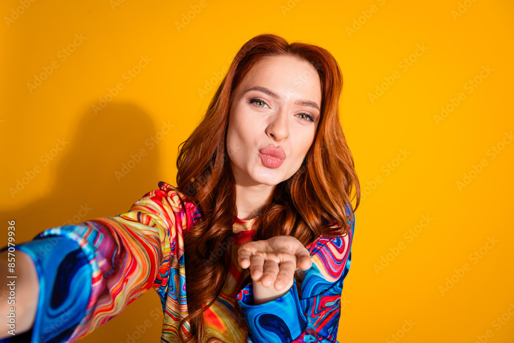 Photo portrait of pretty young girl take selfie photo send air kiss wear trendy colorful outfit isolated on orange color background Photo portrait of pretty young girl take selfie photo send air kiss wear trendy colorful outfit isolated on orange color background