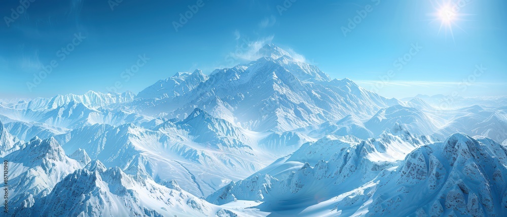 Obraz premium Majestic Snowy Mountain Peaks Under a Bright Blue Sky.