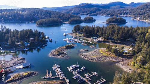 Aerial view over Madeira Park. Boat docks light up by the morning sun. 