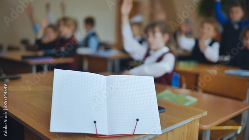Notebook on a stand in the classroom during a lesson.
