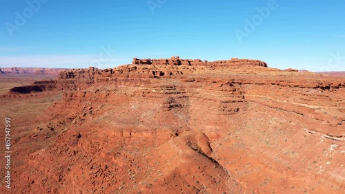 Red rocks layers brick formation crumbling from erosion and weathered. Cliffs similar grand canyon of sandstone in heat desert. Aerial view drone flying. Travel to national parks usa