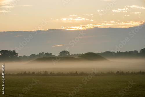 Foggy Summer Solstice Sunrise at Angel Mounds Native American Site.  photo