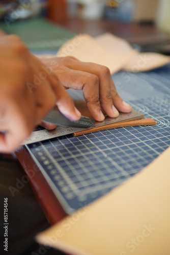 leather craftsmen work to make products