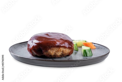 Asian meet hamburger with sauce and vegetables in a plate on a white isolated background