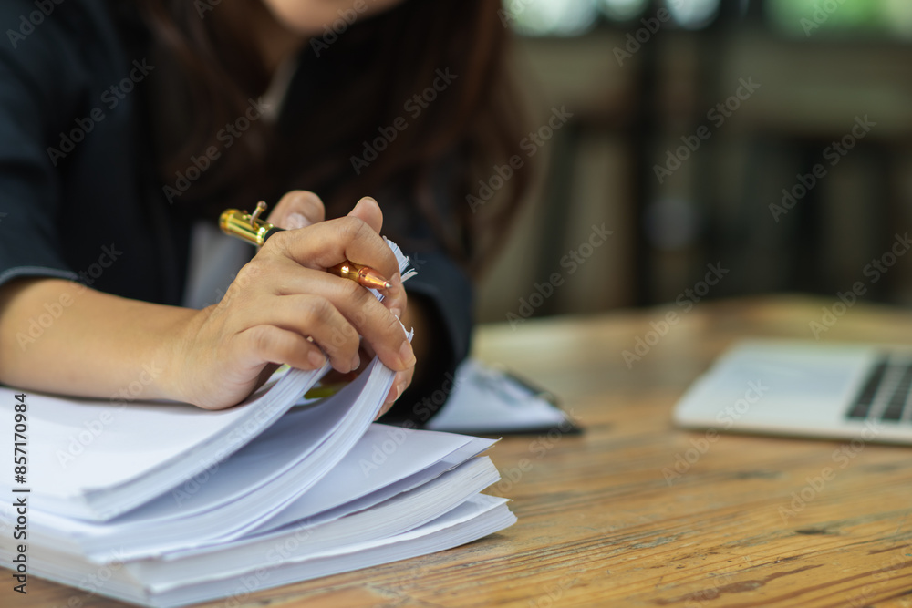 Obraz premium A pile of documents that the secretary has prepared for meetings of the company board of directors and investors. Many documents were arranged and prepared in piles on the desk in the secretary office