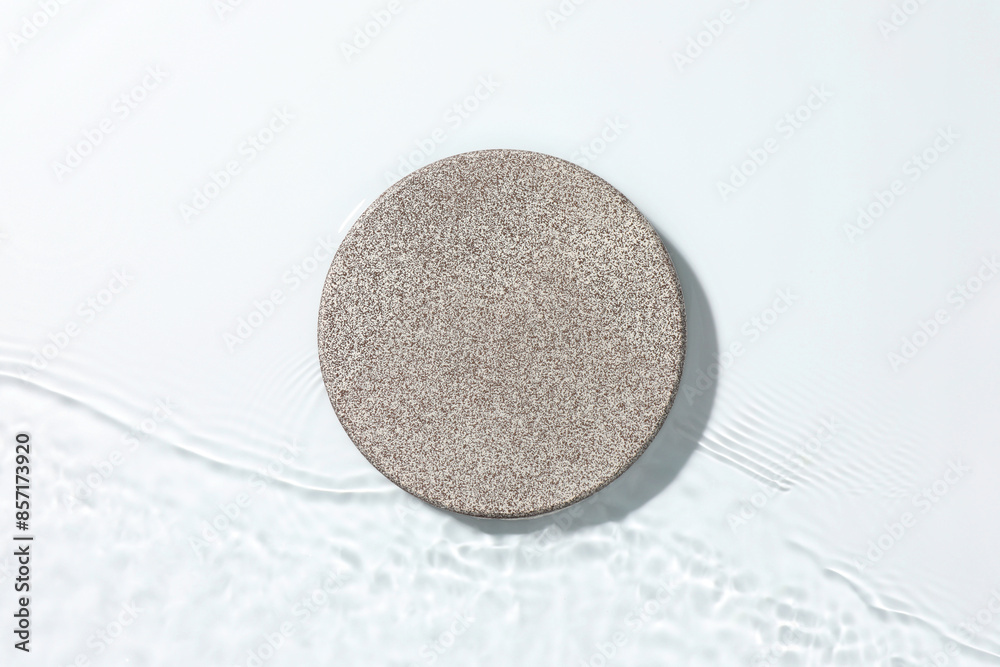 Presentation for product. Stone podium in water on white background, top view Presentation for product. Stone podium in water on white background, top view