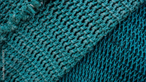background of stacked green fishing nets