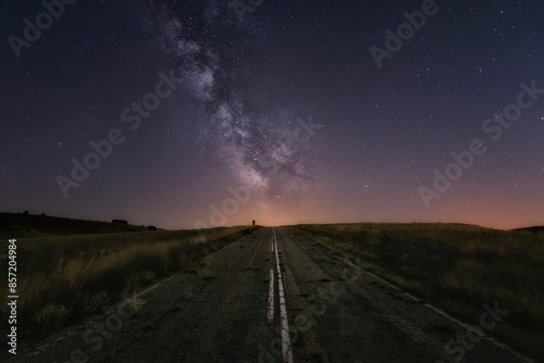 Milky Way over an old road in the Masa moor, Burgos photo