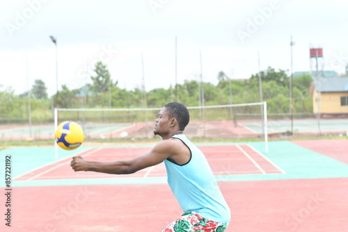 young man playing volleyball. sport, leisure and people concept © Vic Josh