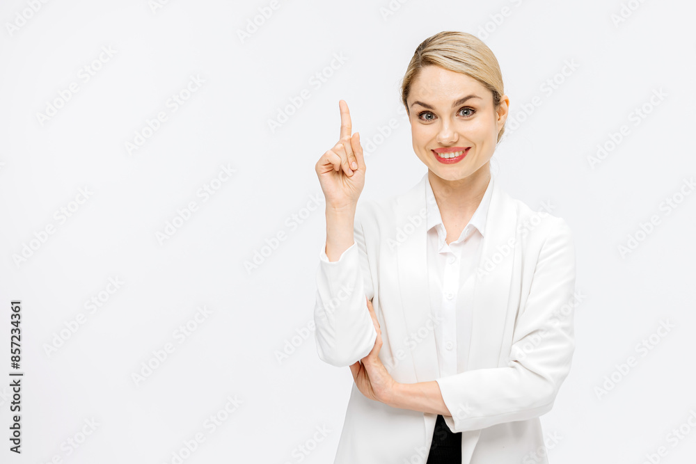 A business blonde in a business suit on a white studio background shows the emotions of a new idea. Business, finance and business solutions concept. A business blonde in a business suit on a white studio background shows the emotions of a new idea. Business, finance and business solutions concept.