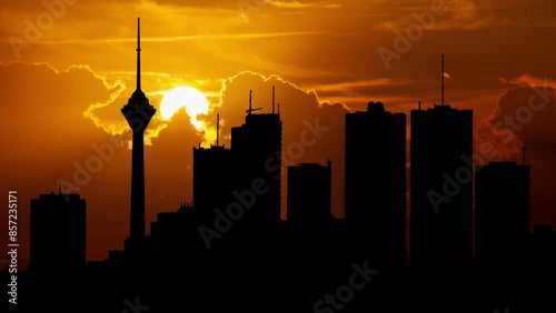 Tehran City Skyline, the Capital of Iran, Time Lapse at Sunset with Red Sun and Fiery Sky
