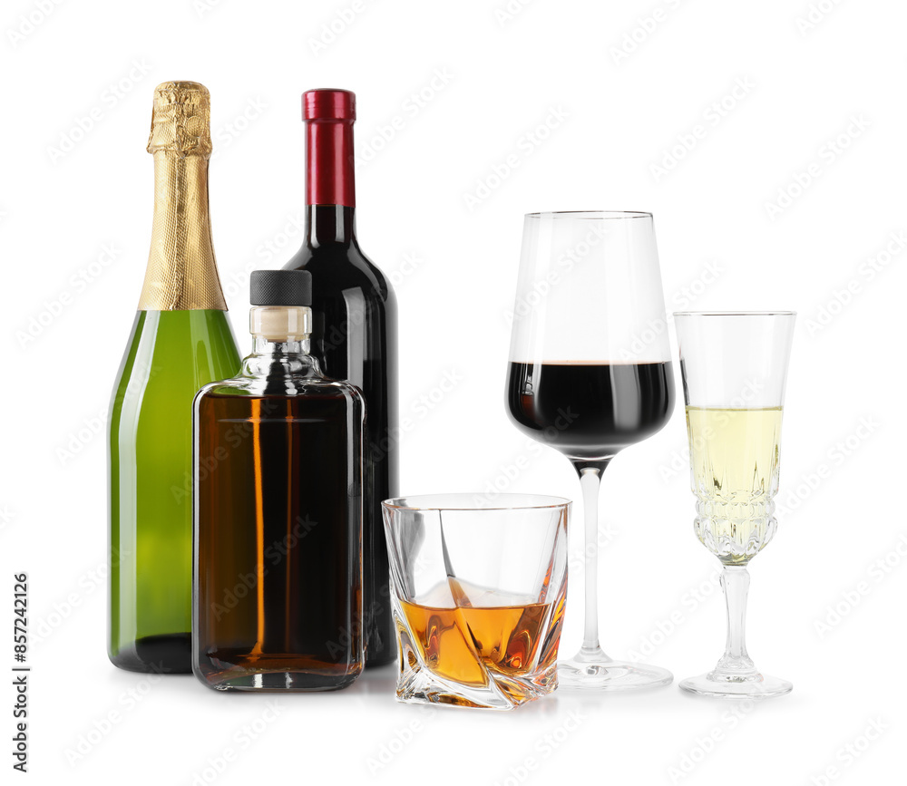 Bottles and glasses with different alcoholic drinks isolated on white Bottles and glasses with different alcoholic drinks isolated on white