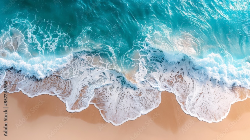 Fototapeta premium abstract sand beach from above with light blue transparent water wave and sun lights, summer vacation background concept 