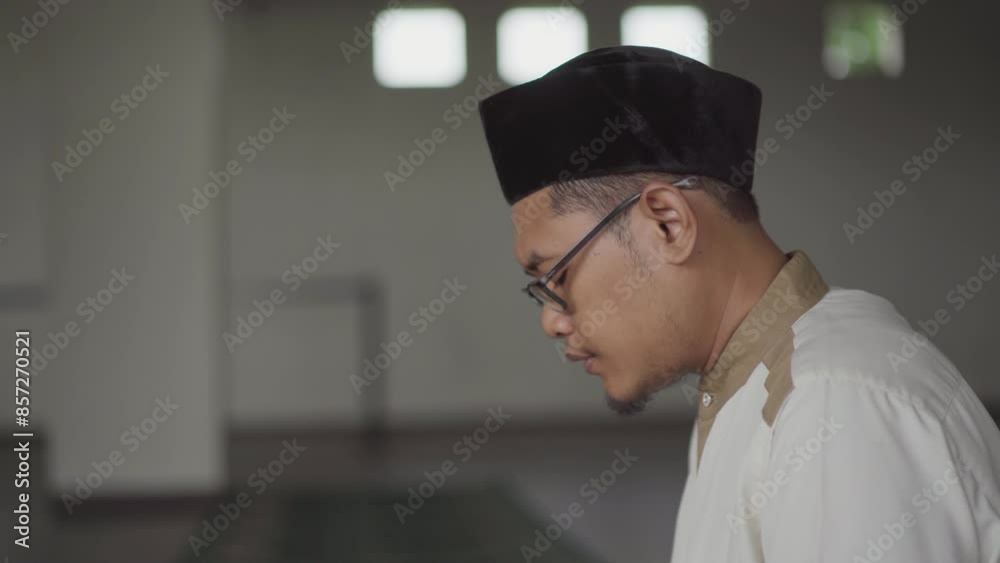 Close up of a Muslim's face reading the Koran in the mosque. Muslims will reading koran more often in the month of Ramadan. Close up of a Muslim's face reading the Koran in the mosque. Muslims will reading koran more often in the month of Ramadan.