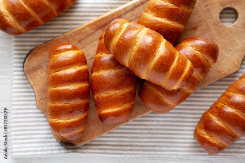 Canvas Print Homemade Kolache Rolls on a rustic wooden board, top view