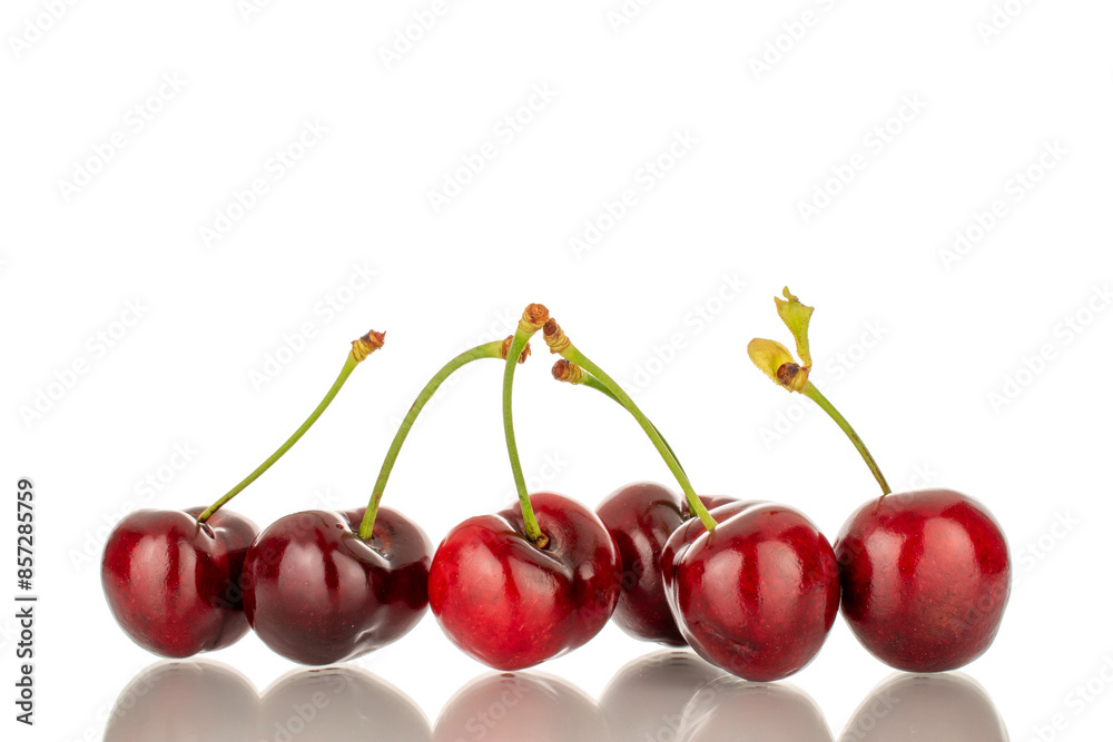 A few sweet cherry berries, macro, isolated on a white background. A few sweet cherry berries, macro, isolated on a white background.