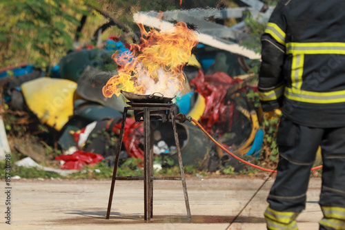 Firefighters demonstrate safe use of gas cylinders to prevent accidents and ensure safety This image captures firefighters in action illustrating the proper handling and safety measures associated wit