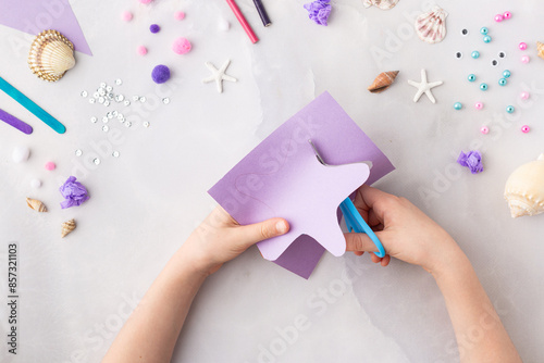 Violet paper sea star summer idea for kids craft in kindergarten hands ocean's day