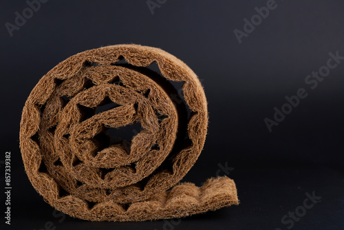 Wallpaper Mural Sample of a layer of rolled coconut fiber on black background. Close up Torontodigital.ca