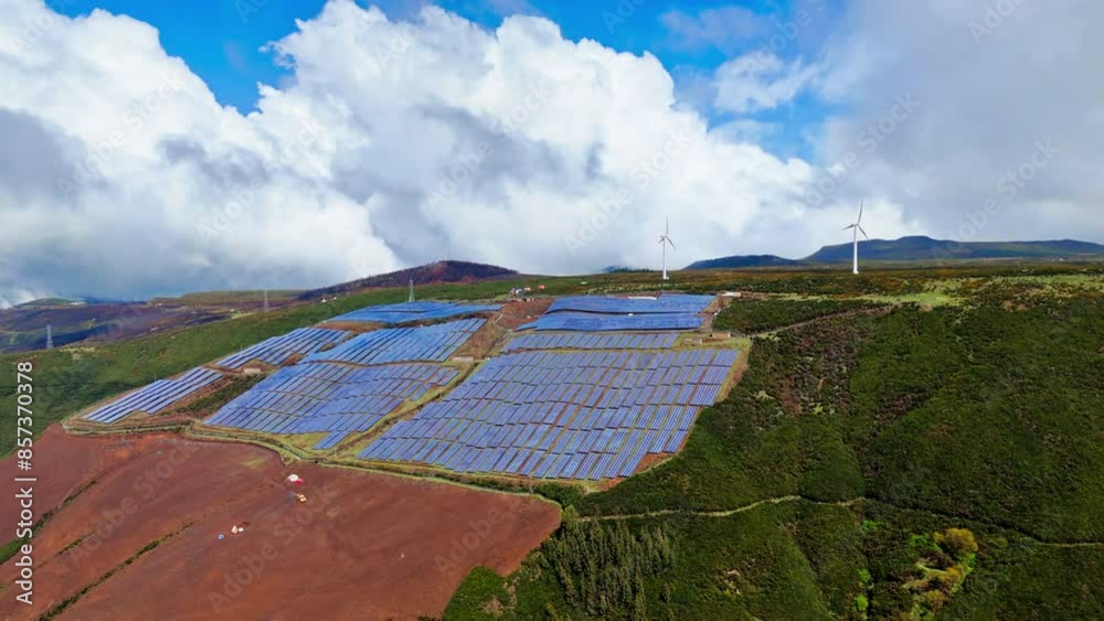 Solar panels and a wind turbines on Madeira symbolize the transition to ...