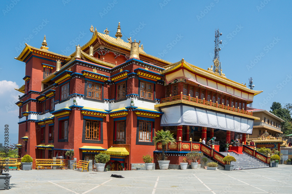 A majestic Buddhist Monastery with a golden roof and grand staircase, Sikkim, India A majestic Buddhist Monastery with a golden roof and grand staircase, Sikkim, India