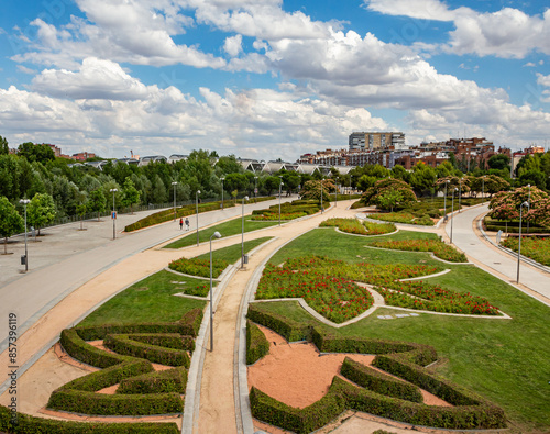 Madrid Rio Park gardens in spring with Arganzuela Bridge in background photo