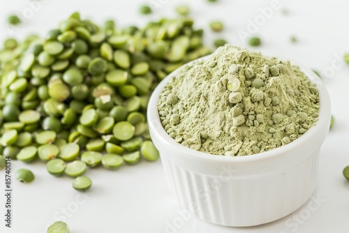 Green pea flour and split peas in white bowl on white background photo