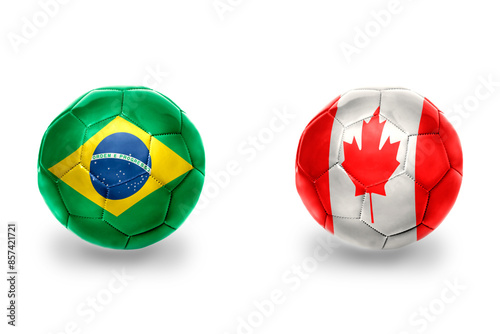 football balls with national flags of brazil and canada ,soccer teams. on the white background. photo