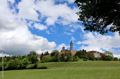 Klosterkirche in Neresheim unter Wolkenhimmel photo