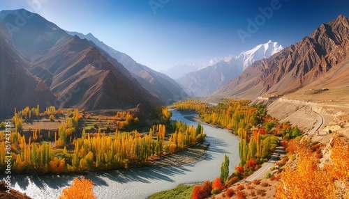 beautiful nature landscape view of winding river flowing along valley in hindu kush mountain range autumn season in gupis ghizer gilgit baltistan pakistan photo