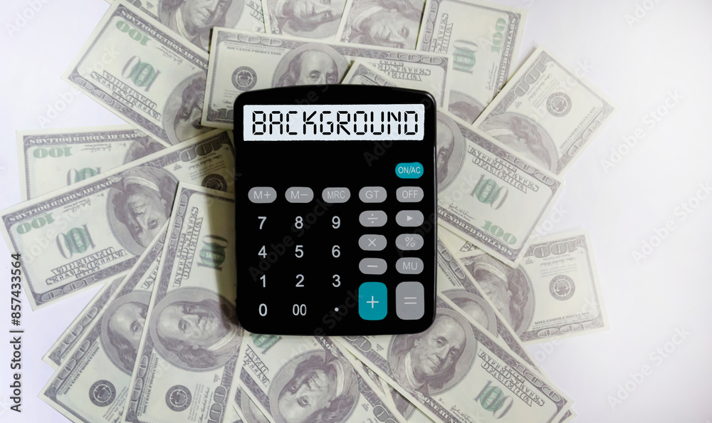 On the calculator is the word VALUATION on dollar bills. Cost calculation or estimation concept