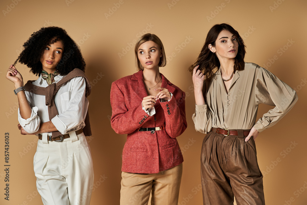 Three young multicultural women in chic outfits stand side by side, showcasing friendship and cultural diversity. Three young multicultural women in chic outfits stand side by side, showcasing friendship and cultural diversity.