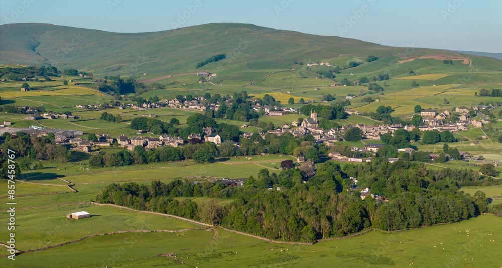 A scenic aerial shot capturing the essence of Hawes, nestled among vibrant green fields in the Yorkshire Dales, UK, reflecting rural beauty A scenic aerial shot capturing the essence of Hawes, nestled among vibrant green fields in the Yorkshire Dales, UK, reflecting rural beauty