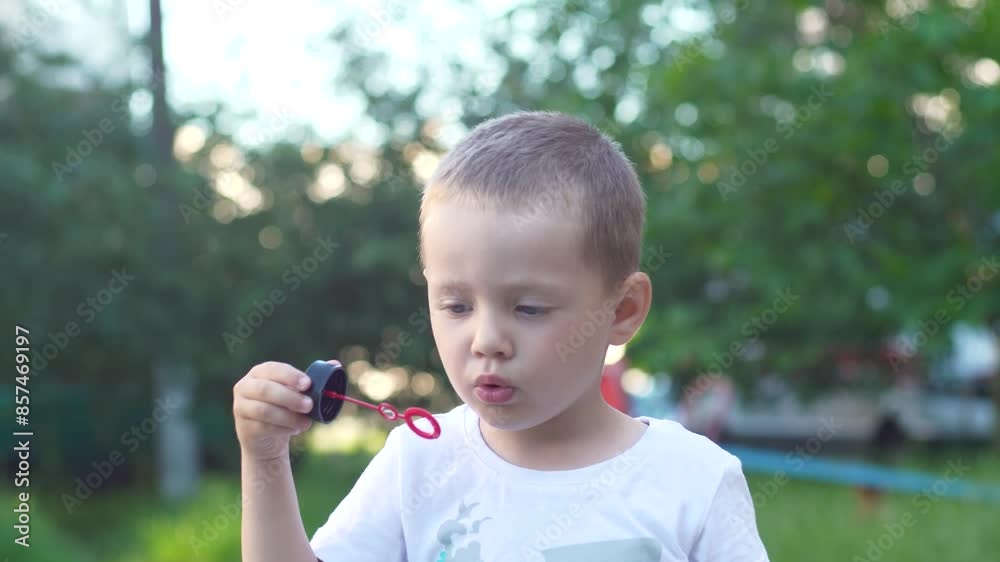 Close-up portrait of a boy blowing soap bubbles Close-up portrait of a boy blowing soap bubbles