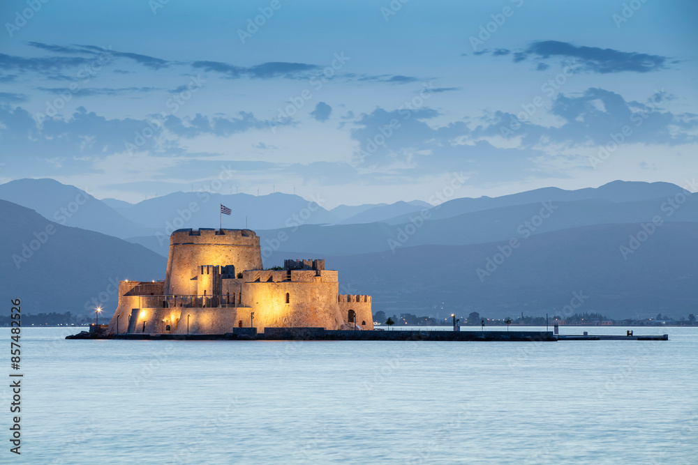 Venetian Castle of Bourtzi in the Bay of Nauplion at the dusk, Greece Venetian Castle of Bourtzi in the Bay of Nauplion at the dusk, Greece