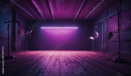 Empty studio with purple lighting and wooden floor photo