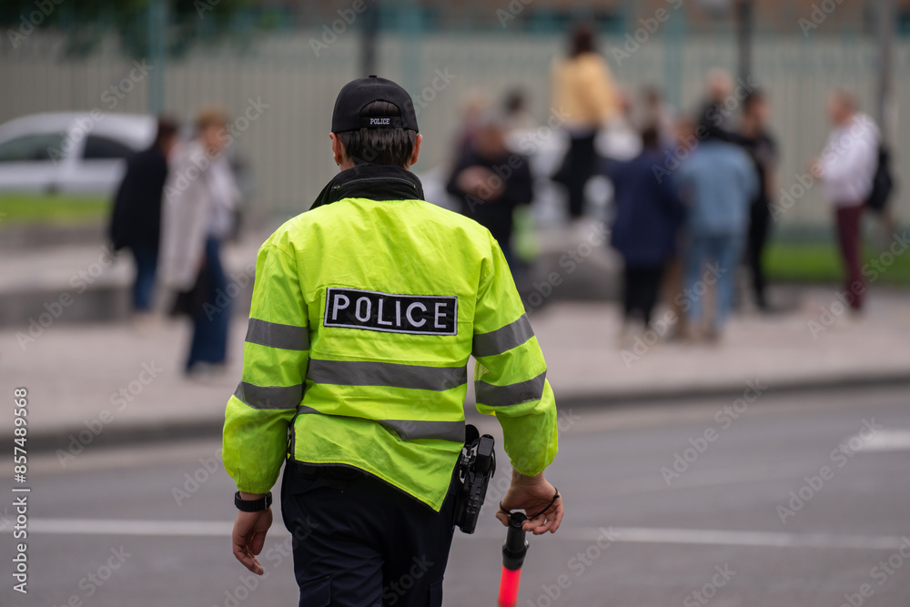Traffic policeman regulating traffic, work process Traffic policeman regulating traffic, work process