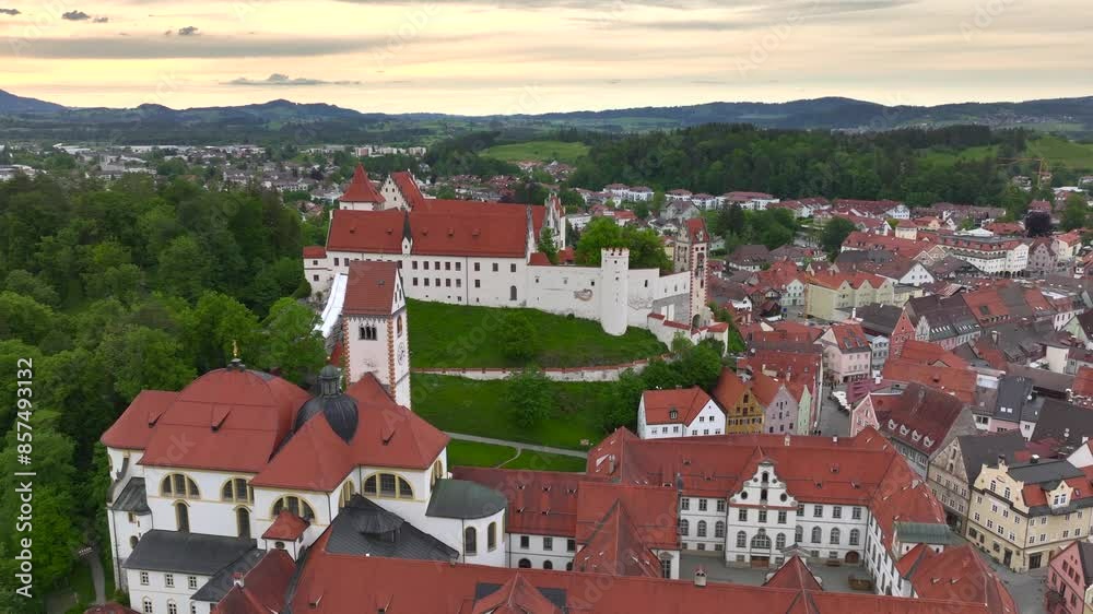 Fussen, Bavaria, Germany. Aerial view over the medieval town at sunset time. Historical Palace, Hohes Schloss. Fussen, Bavaria, Germany. Aerial view over the medieval town at sunset time. Historical Palace, Hohes Schloss.