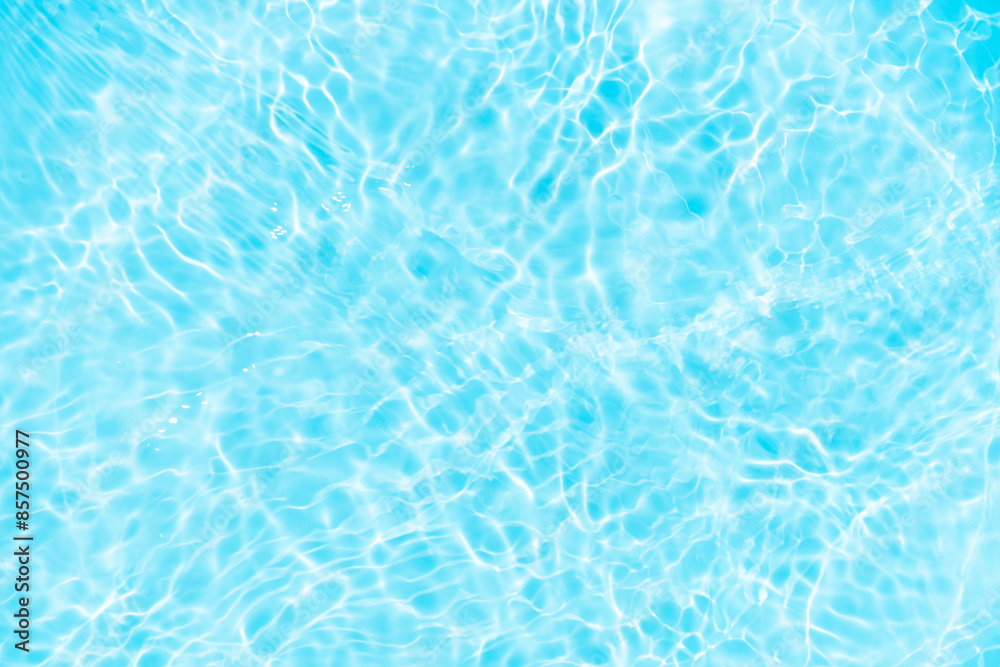 Blue water with ripples on the surface. Defocus blurred transparent blue colored clear calm water surface texture with splashes and bubbles. Water waves with shining pattern texture background. Blue water with ripples on the surface. Defocus blurred transparent blue colored clear calm water surface texture with splashes and bubbles. Water waves with shining pattern texture background.