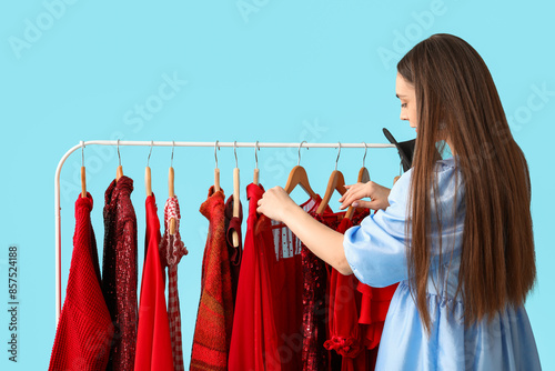 Female stylist with clothes...