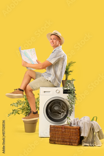 Male tourist with map sitti...