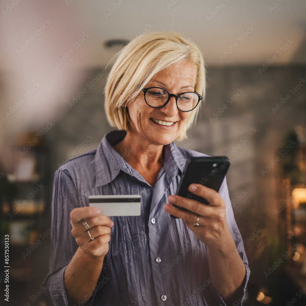 Portrait of senior woman buy online on cellphone with credit card Portrait of senior woman buy online on cellphone with credit card
