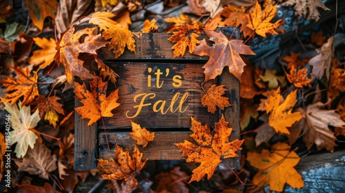 Creative design on wood sign with playful text saying Fall. Focus on seasonal theme and decor.